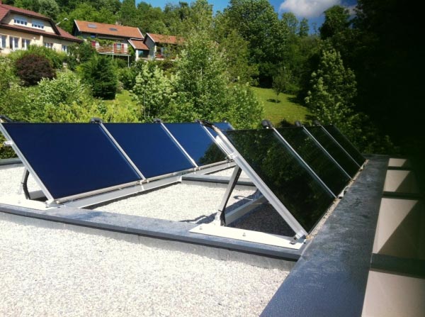 installation de chauffage solaire thermique combiné (ssc) solisart avec appoint poêle bouilleur sur plancher chauffant et radiateurs