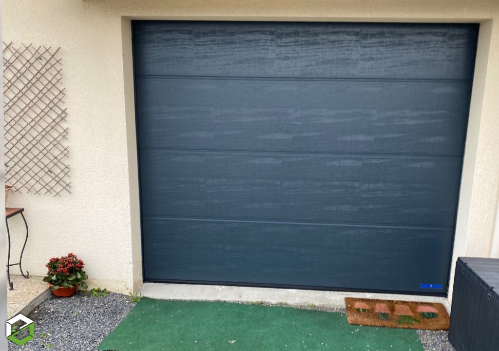 Berthe Sébastien : Remplacement de porte de garage basculante par une porte sectionnelle motorisée