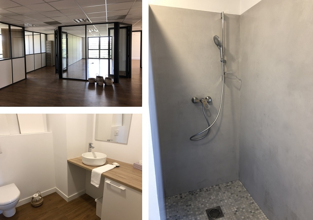 artisan spécialiste de la création de salle de bain avec douche italienne dans un espace de bureau